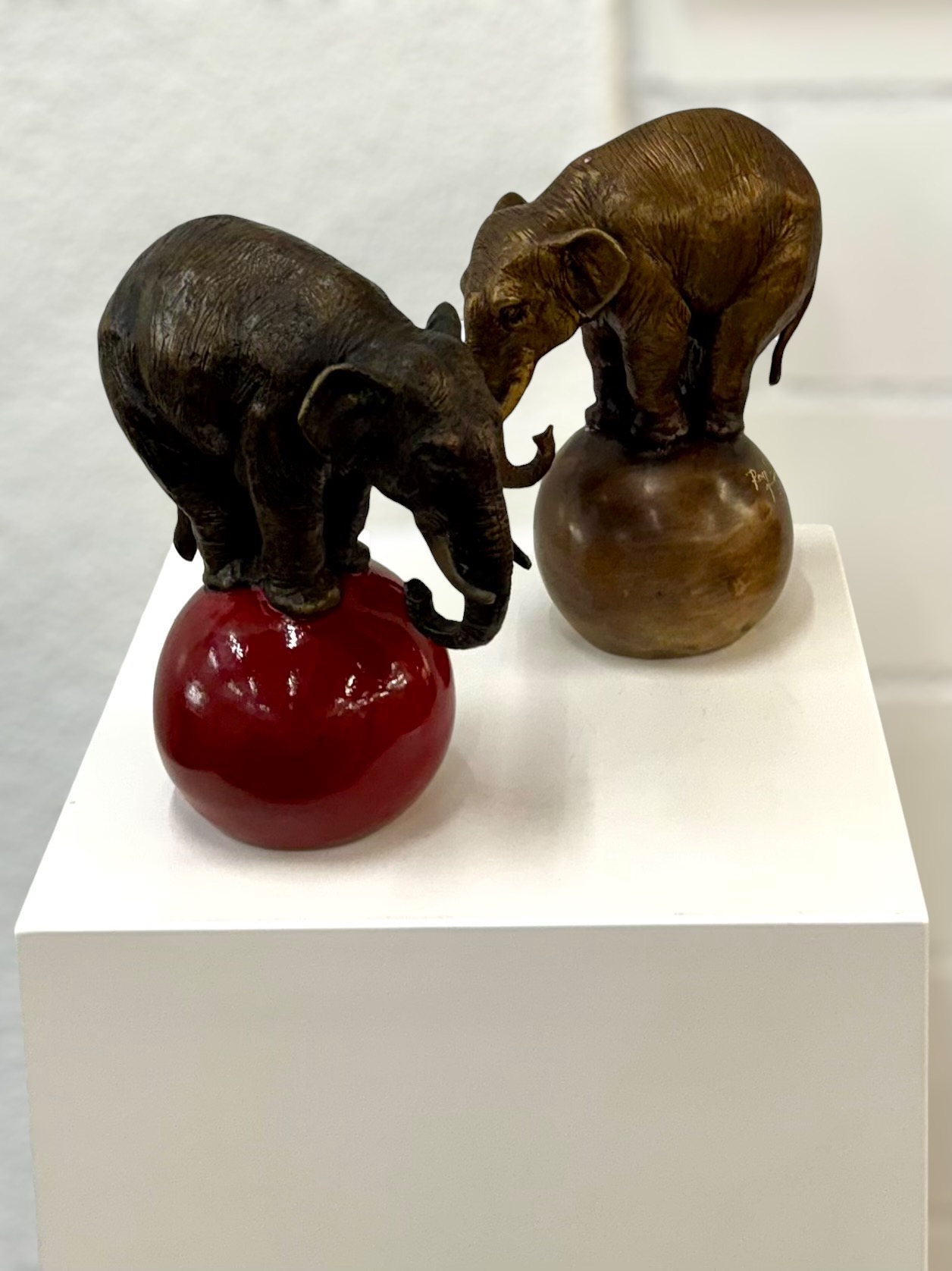 Elephant on four legs on red ball